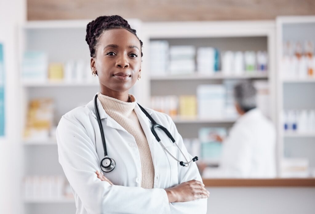 Pharmacy, pharmacist or portrait of black woman with arms crossed in healthcare clinic or drugstore